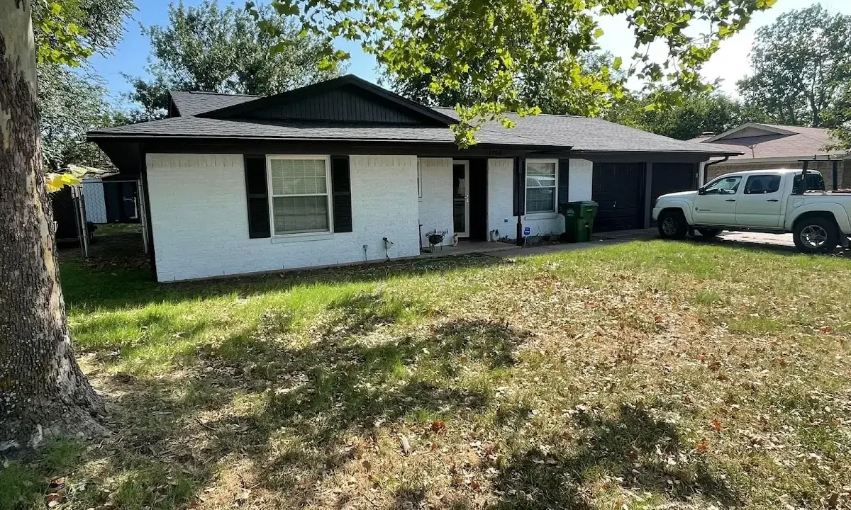 Professional roofing crew working on a residential roof in Forest Park